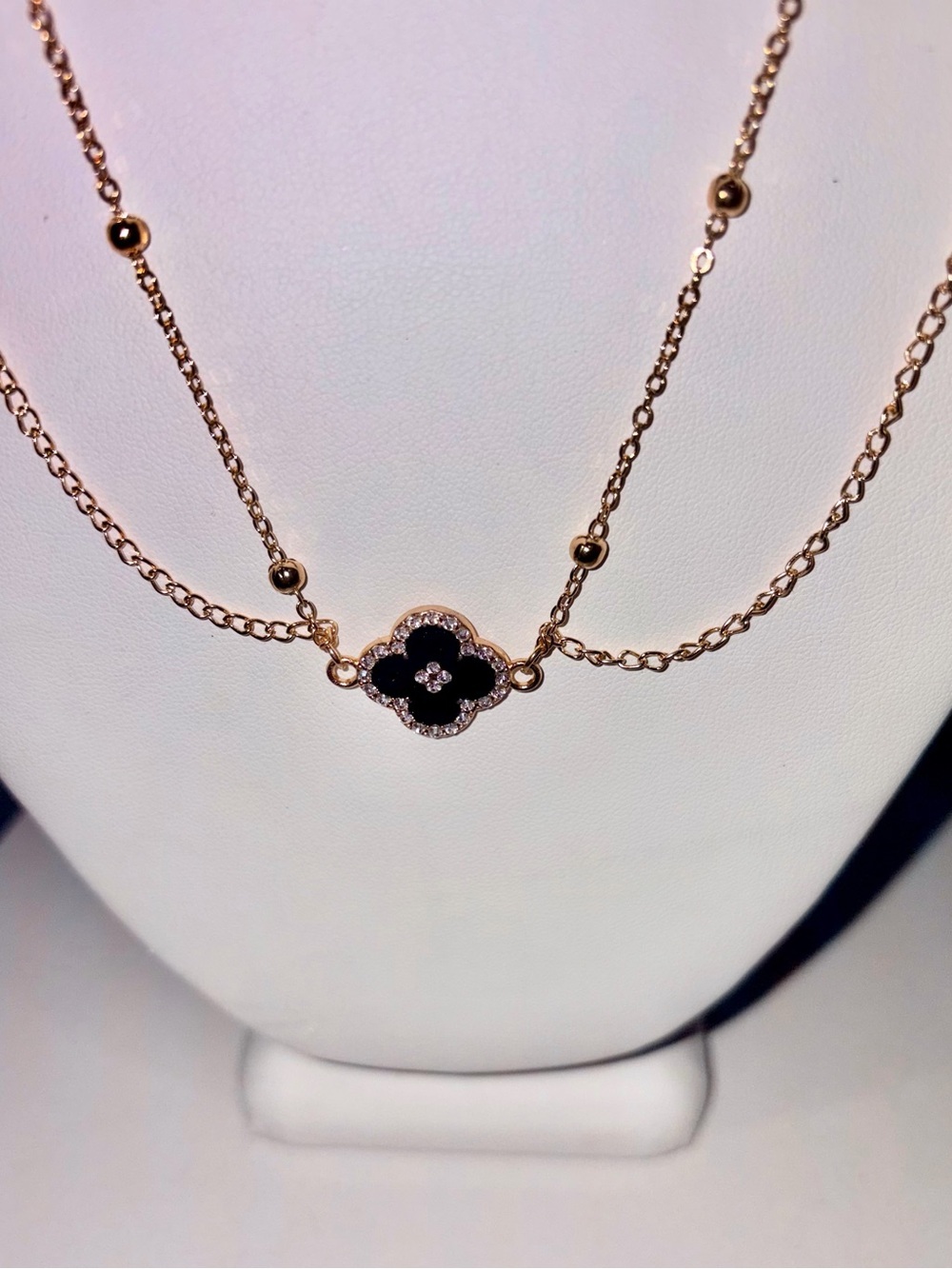Gold Tone Layered Clover Motif Necklace with Black Enamel & Crystal Detail